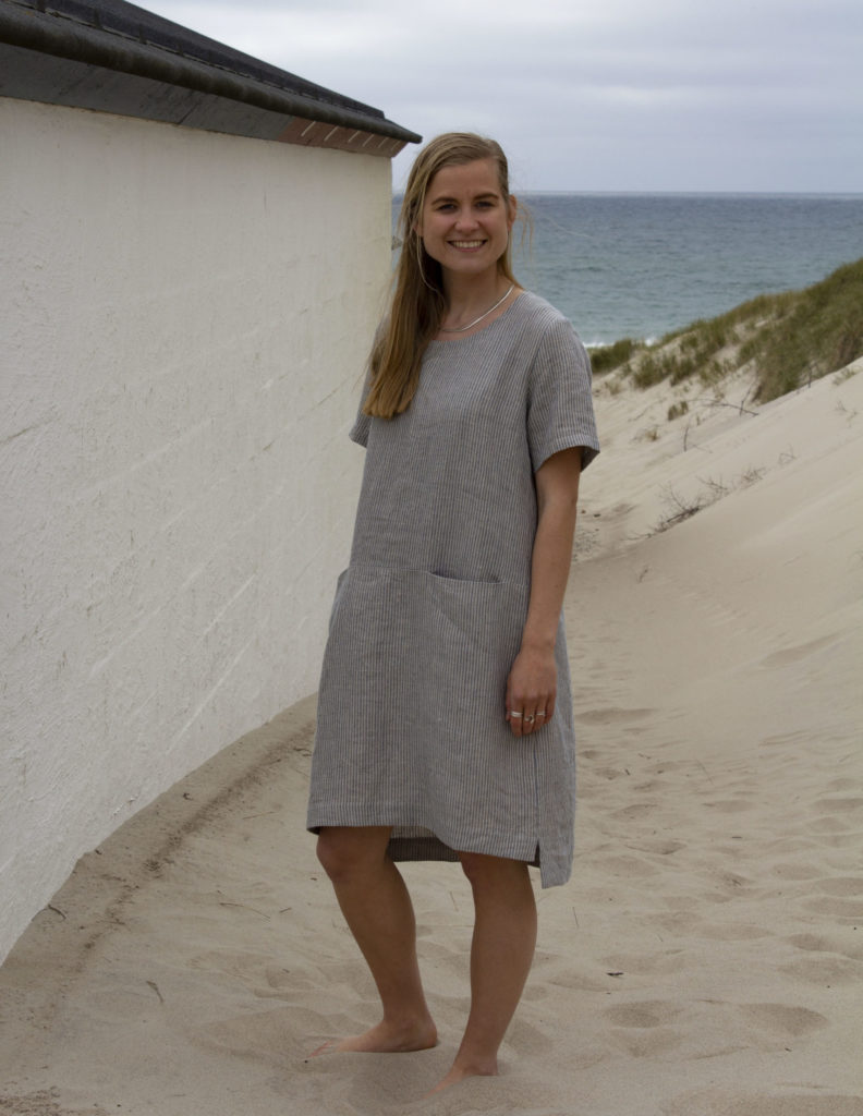 Woman in striped linen dress